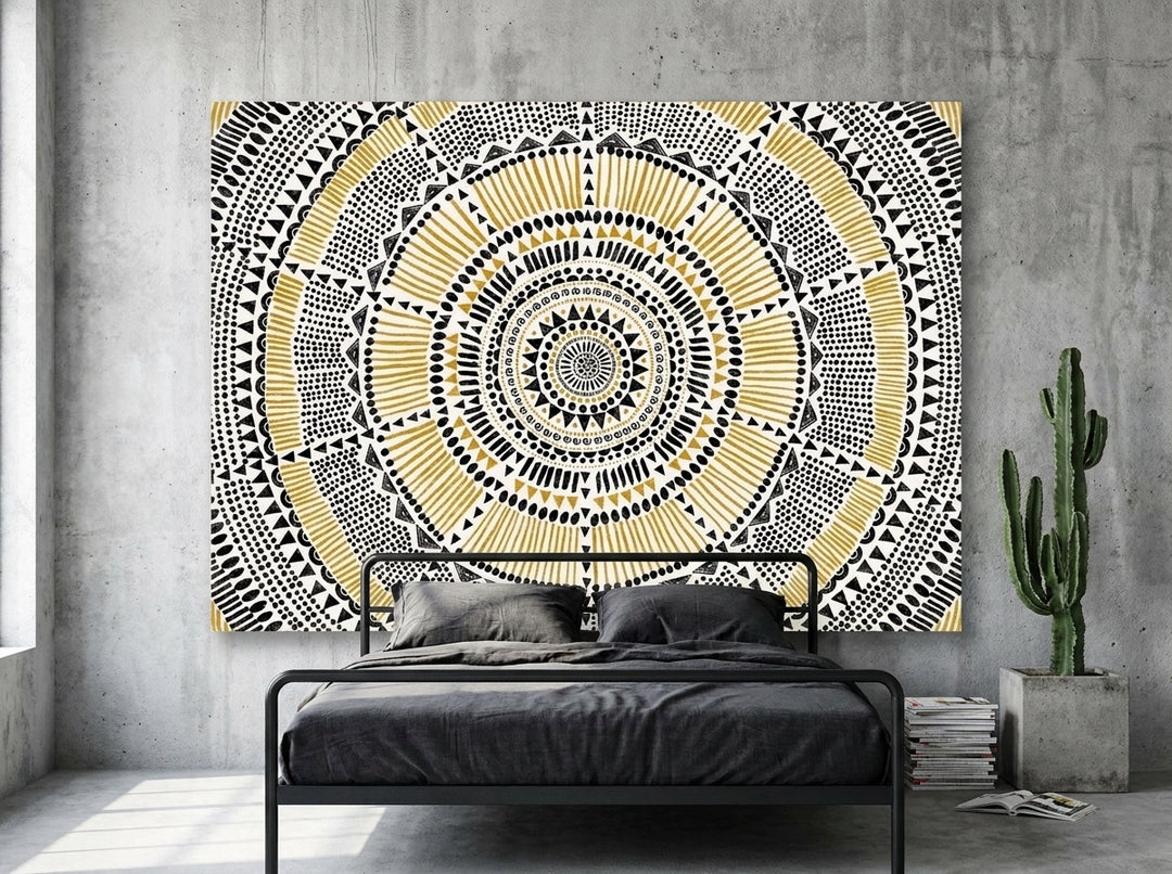 Stretched canvas wall art styled on the wall in an industrial loft bedroom