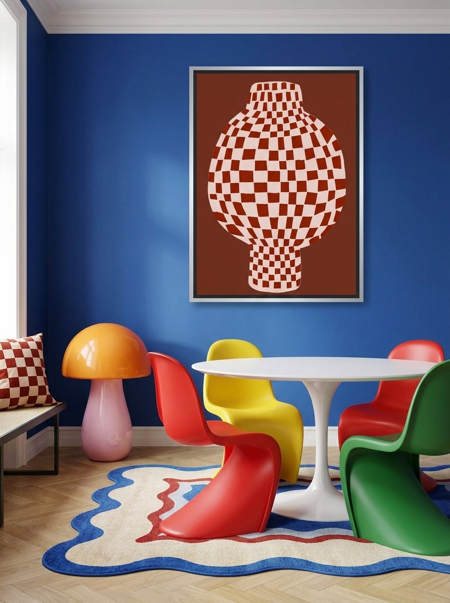 Canvas wall art with a silver leaf surround styled on the wall in a colourful eclectic dining room