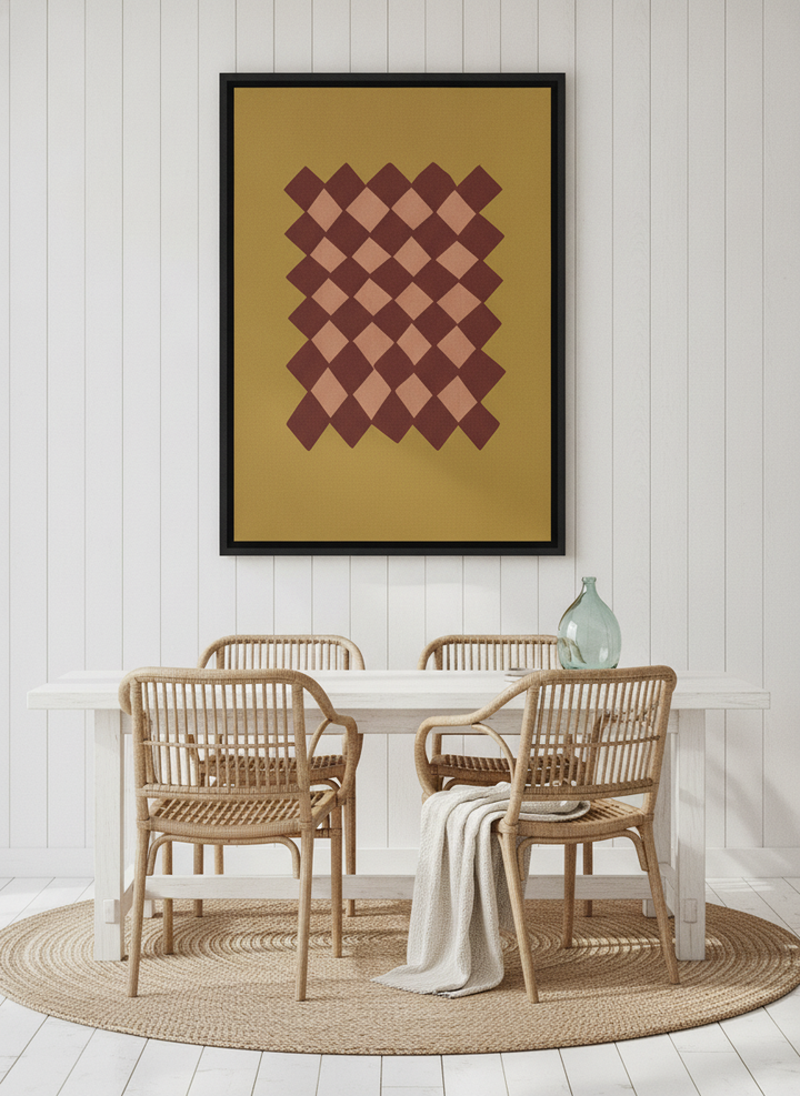 Canvas wall art with a black surround styled on the wall in a coastal dining room