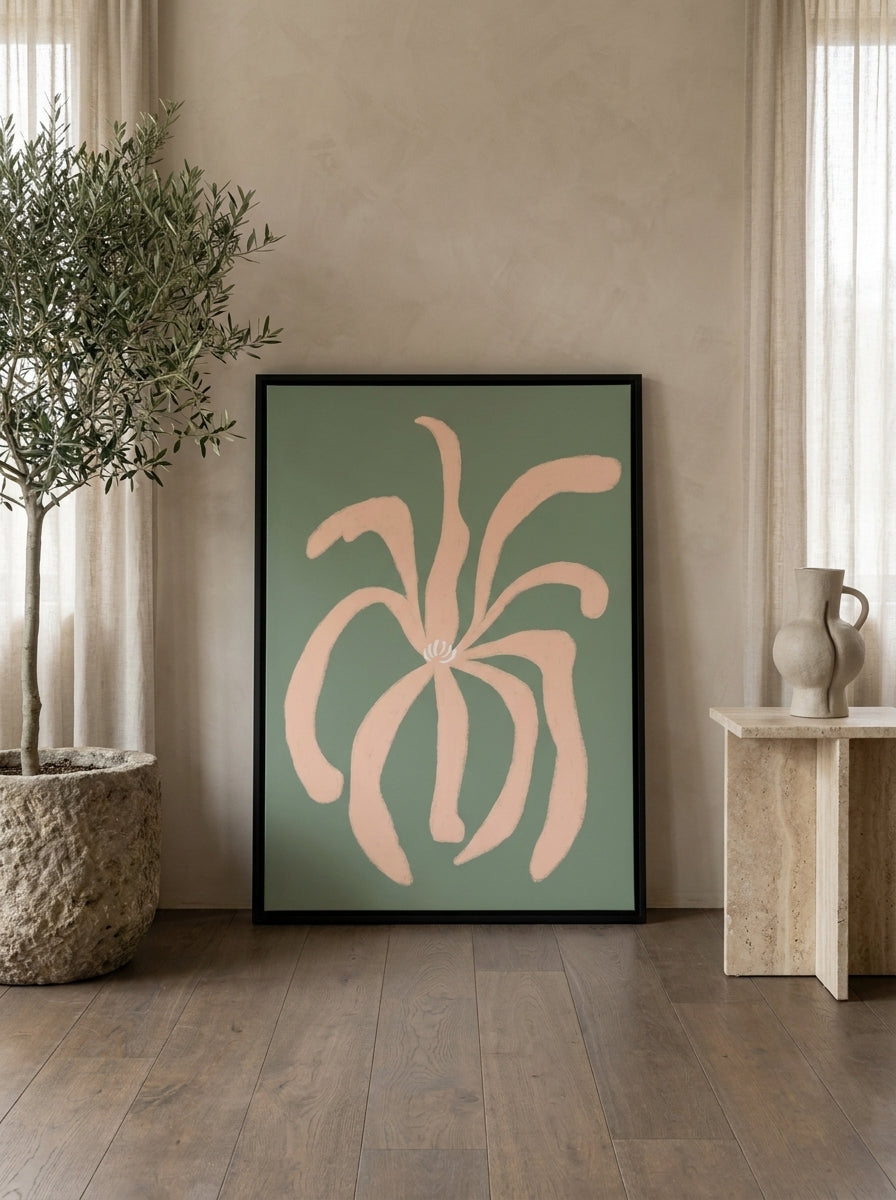 Canvas wall art with a black surround leaning against the wall in a luxe living room
