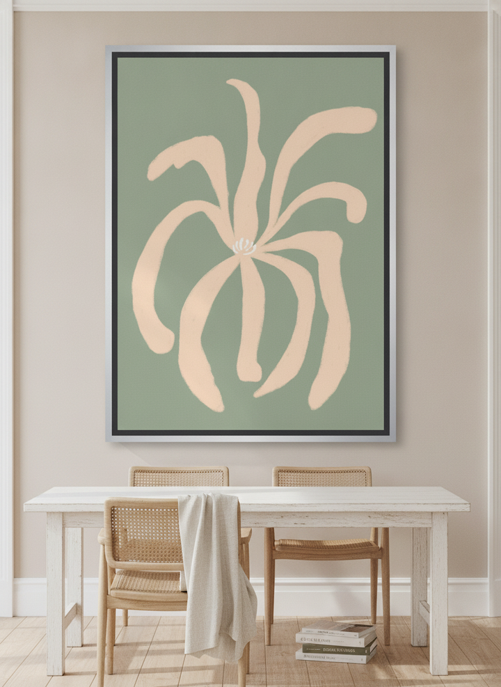 Oversized statement canvas wall art with a silver leaf surround styled on the wall in a coastal dining room