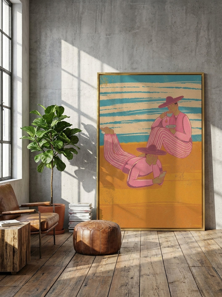 Oversized statement canvas wall art with a gold leaf surround leaning against the wall in an industrial loft living room