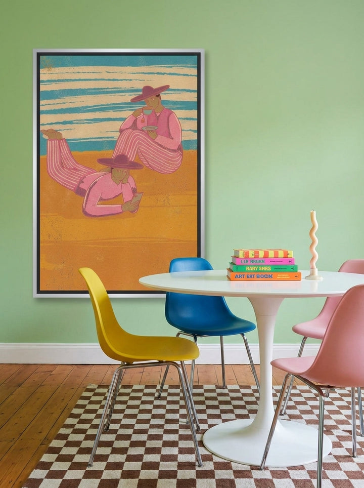 Canvas wall art with a silver leaf surround styled on the wall in a colourful eclectic dining room