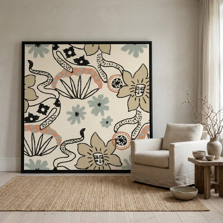 Oversized statement canvas wall art with a black surround leaning against the wall in a warm Japandi living room