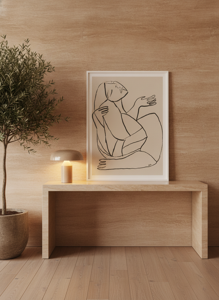 Modern wall art print standing on a console in a luxe home office