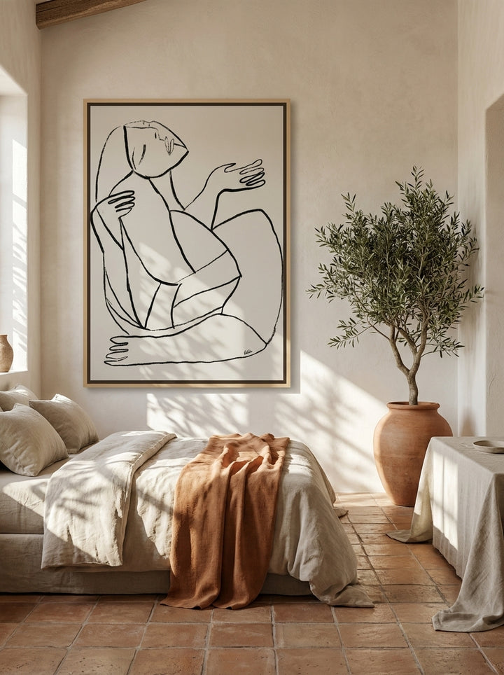 Oversized statement canvas wall art with a natural timber surround styled on the wall in a Mediterranean bedroom