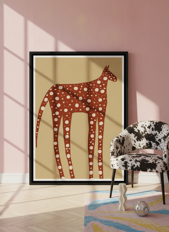 Oversized statement canvas wall art with a black surround leaning against the wall in a colourful eclectic dining room