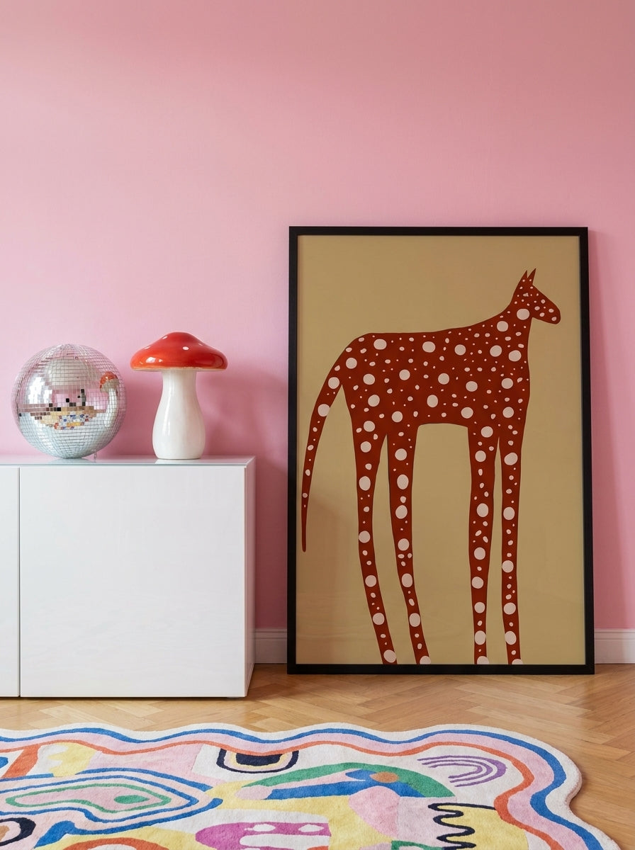 Modern wall art print standing on a sideboard in a colourful eclectic nursery