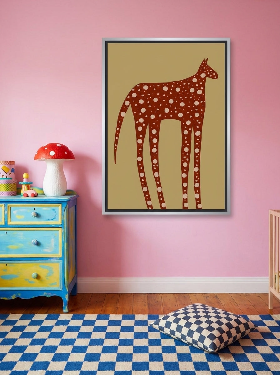 Canvas wall art with a silver leaf surround styled on the wall in a colourful eclectic nursery