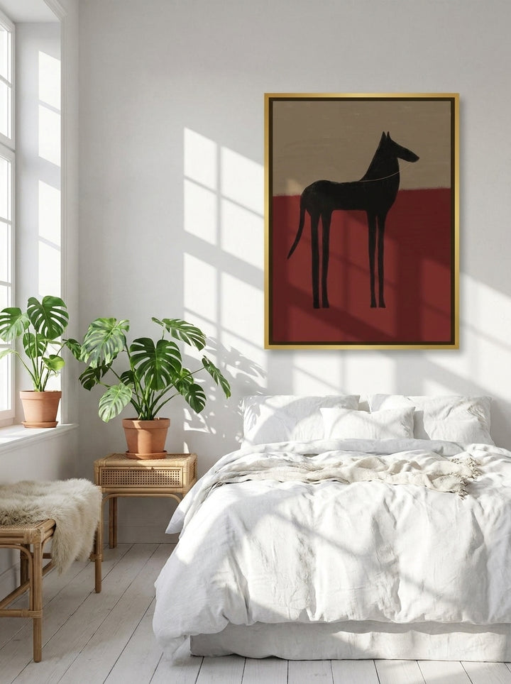 Canvas wall art with a gold leaf surround styled on the wall in a bright Scandinavian bedroom