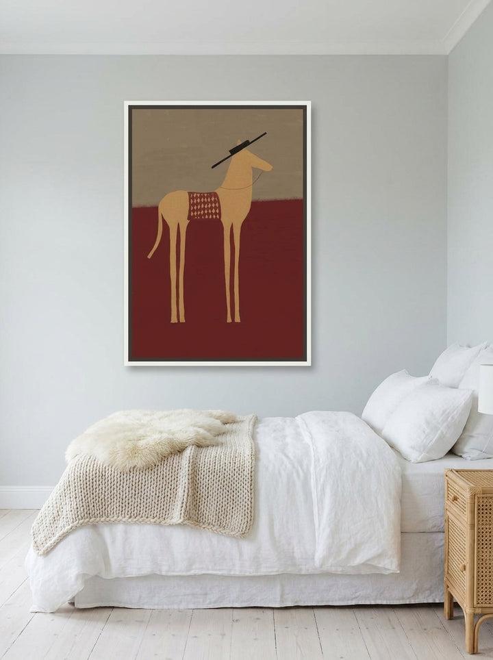 Canvas wall art with a white surround styled on the wall in a bright Scandinavian bedroom