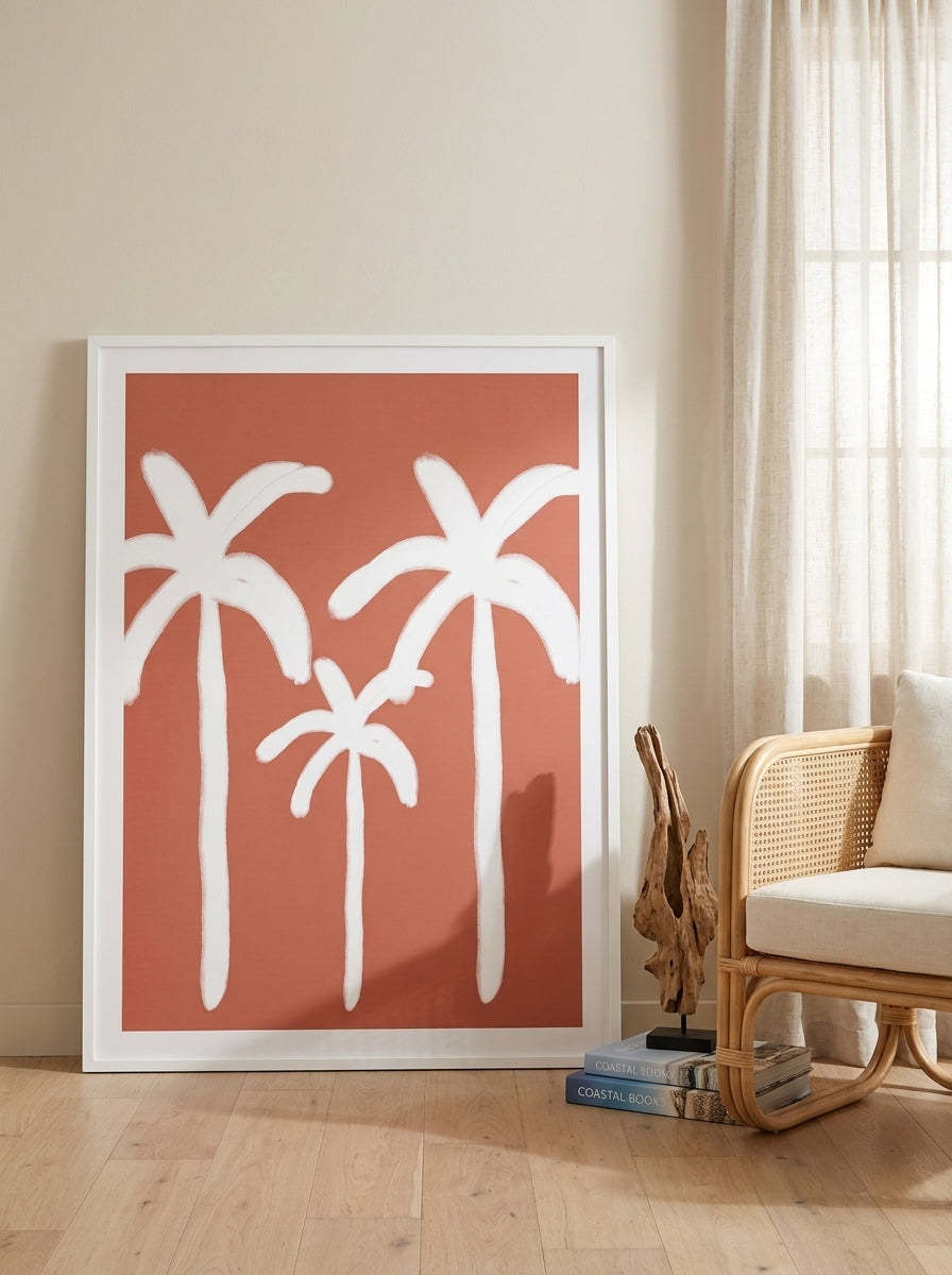 Oversized statement modern wall art print leaning against the wall in a coastal living room
