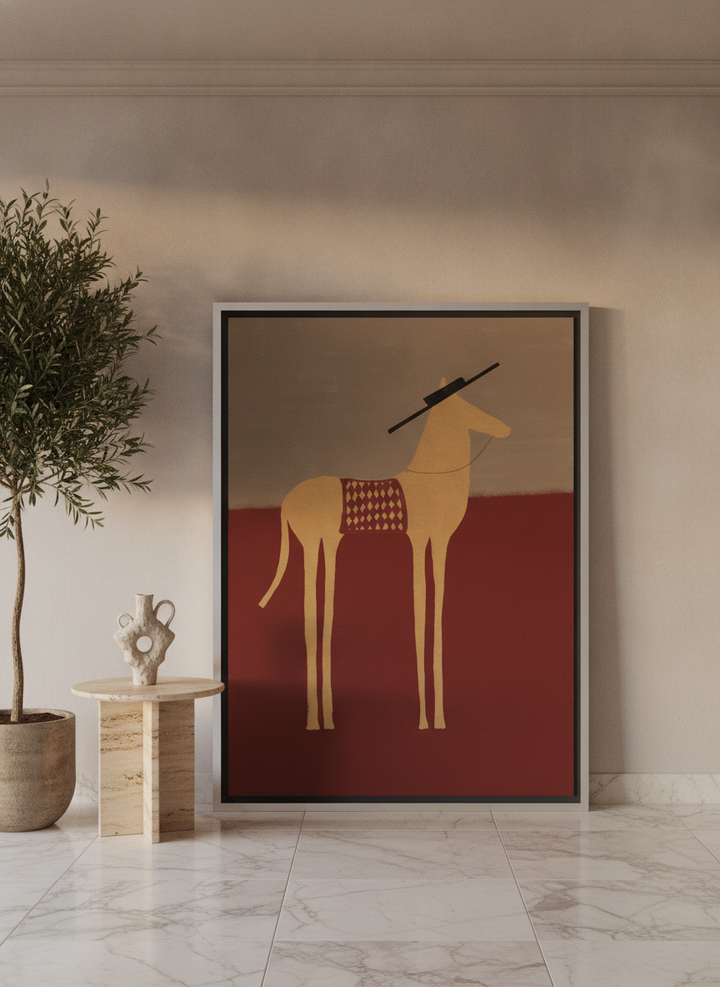 Oversized statement canvas wall art with a silver leaf surround leaning against the wall in a luxe living room
