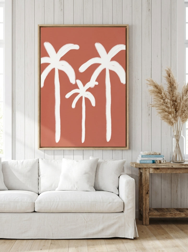 Oversized statement canvas wall art with a natural timber surround styled on the wall in a coastal living room