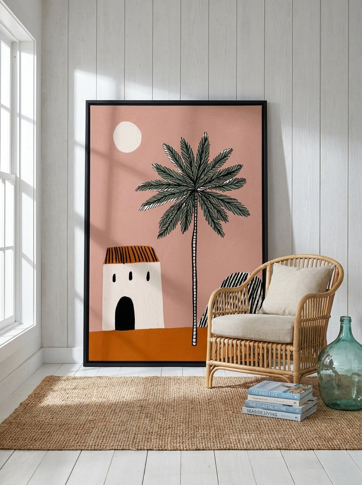 Oversized statement canvas wall art with a black surround leaning against the wall in a coastal bedroom