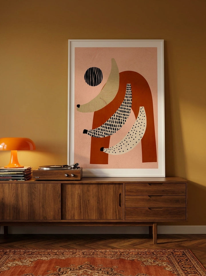Modern wall art print standing on a sideboard in a retro 70s living room