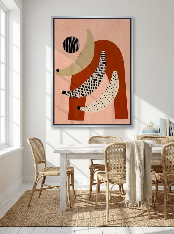 Oversized statement canvas wall art with a silver leaf surround styled on the wall in a coastal dining room