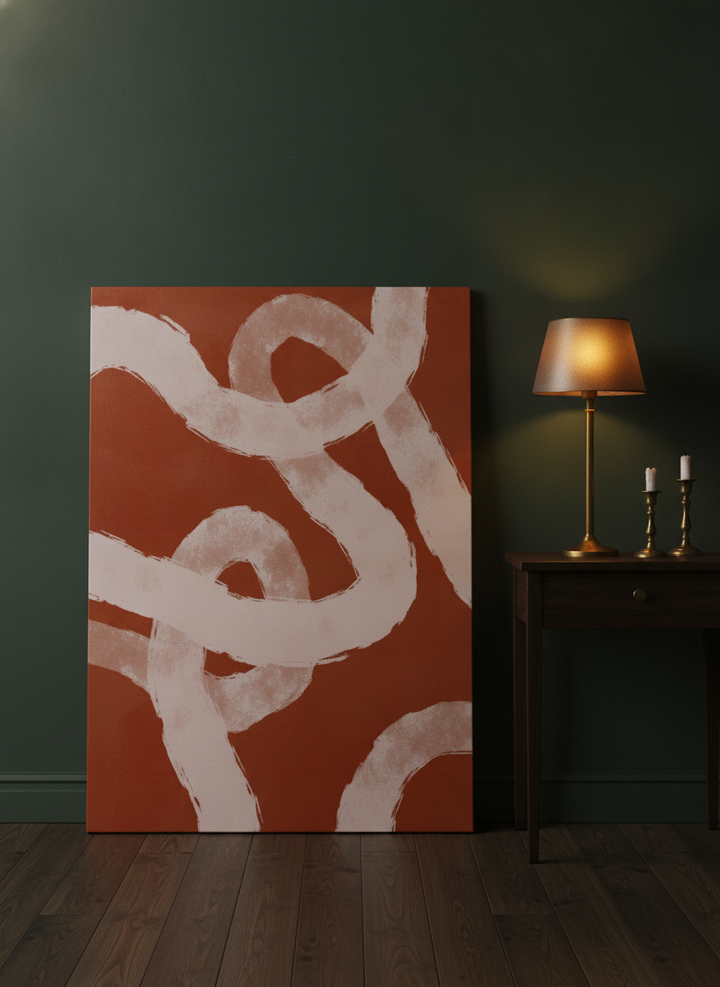 Stretched canvas wall art leaning against the wall in a moody bedroom