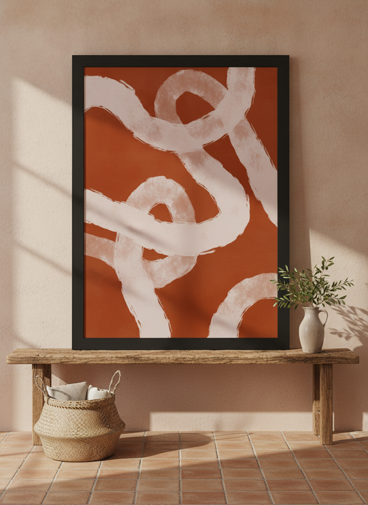 Modern wall art print standing on a bench in a Mediterranean bedroom