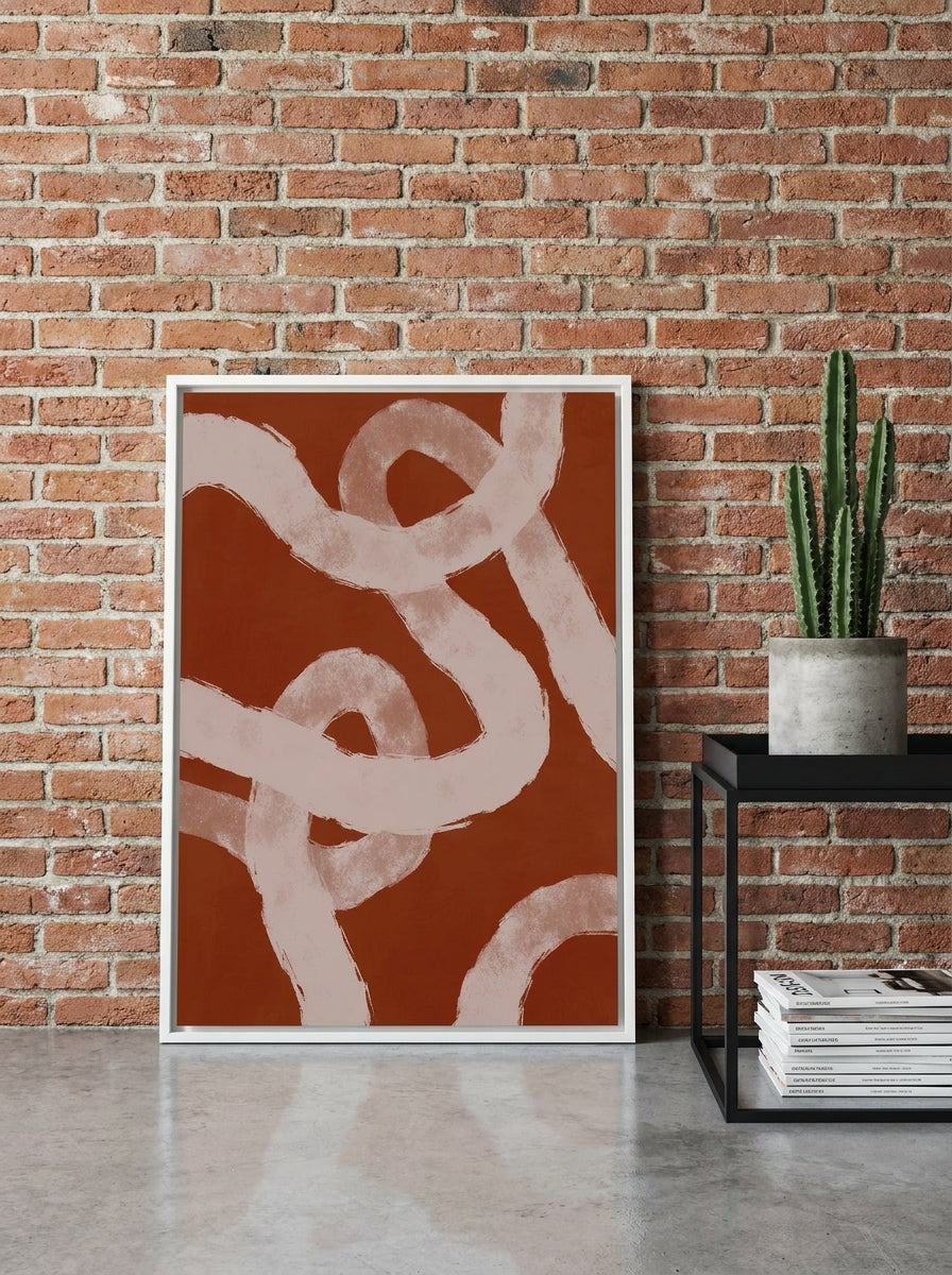 Canvas wall art with a white surround leaning against the wall in an industrial loft dining room