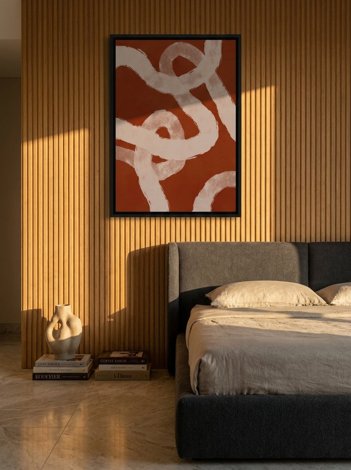 Oversized statement canvas wall art with a black surround styled on the wall in a luxe bedroom
