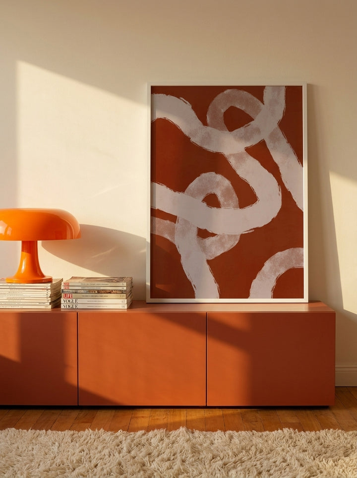 Modern wall art print standing on a sideboard in a retro 70s home office