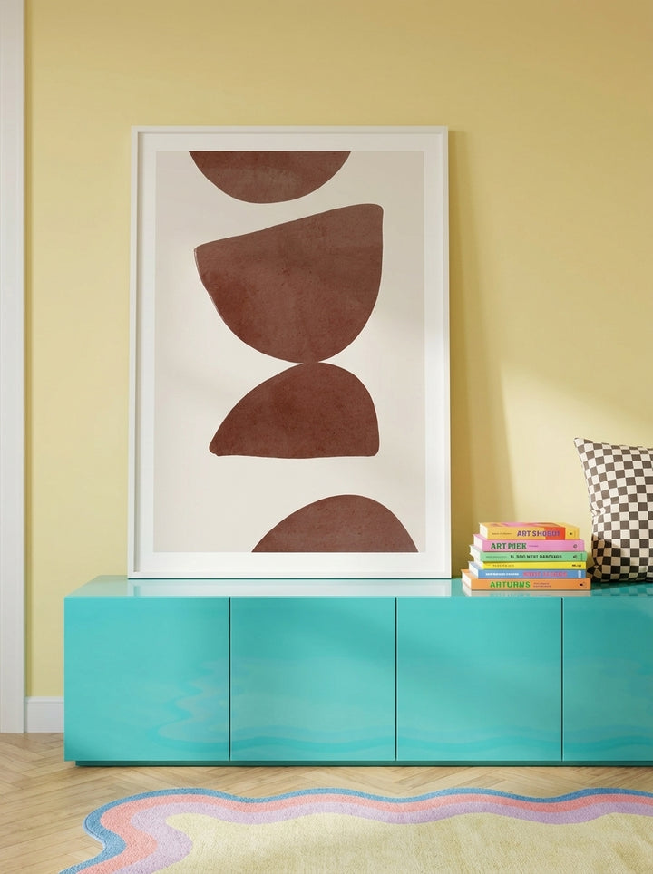 Modern wall art print standing on a sideboard in a colourful eclectic bedroom