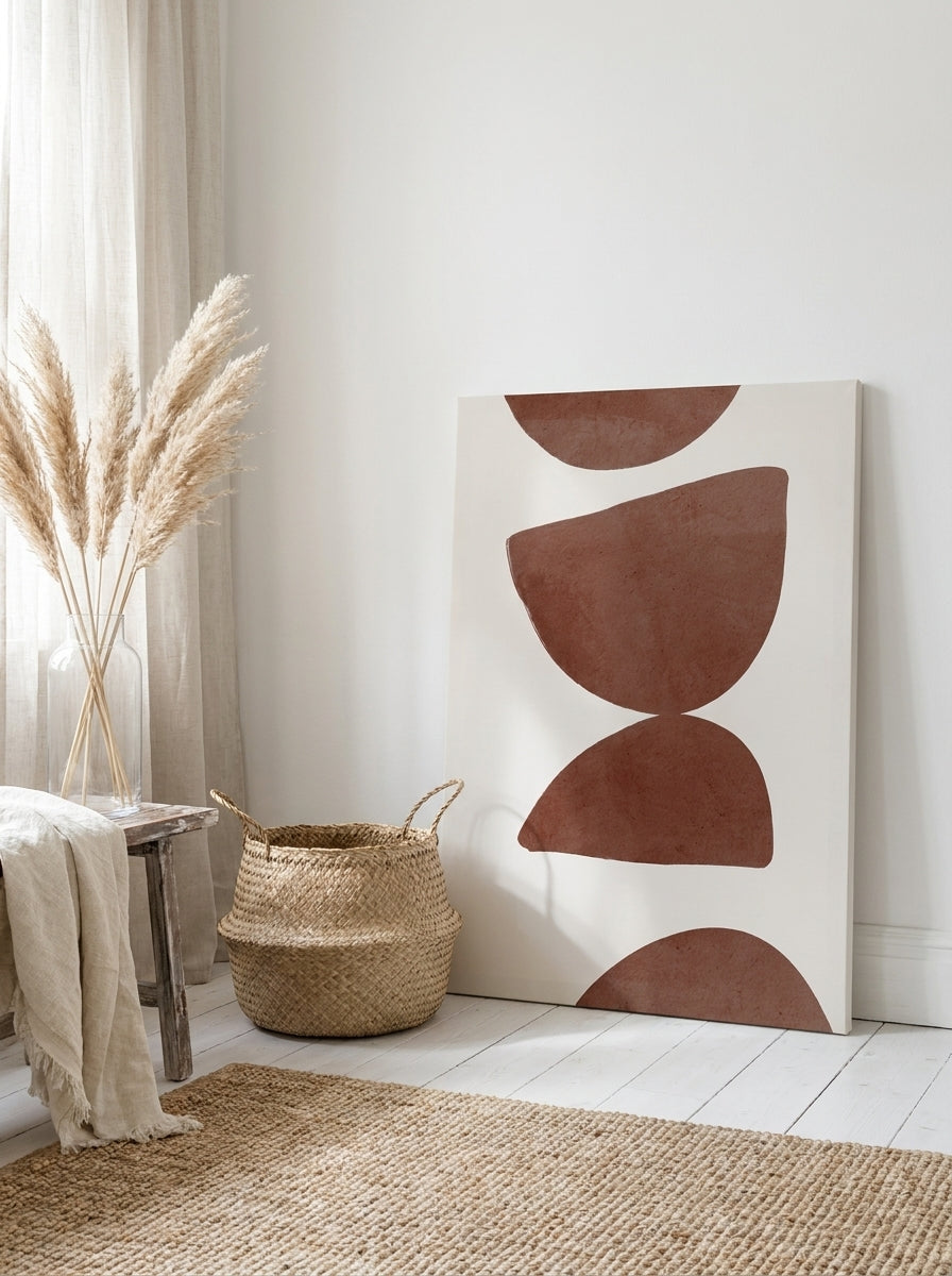 Stretched canvas wall art leaning against the wall in a coastal home office