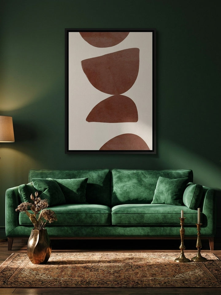 Canvas wall art with a black surround styled on the wall in a moody living room