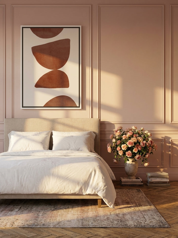 Canvas wall art with a white surround styled on the wall in a Parisian bedroom