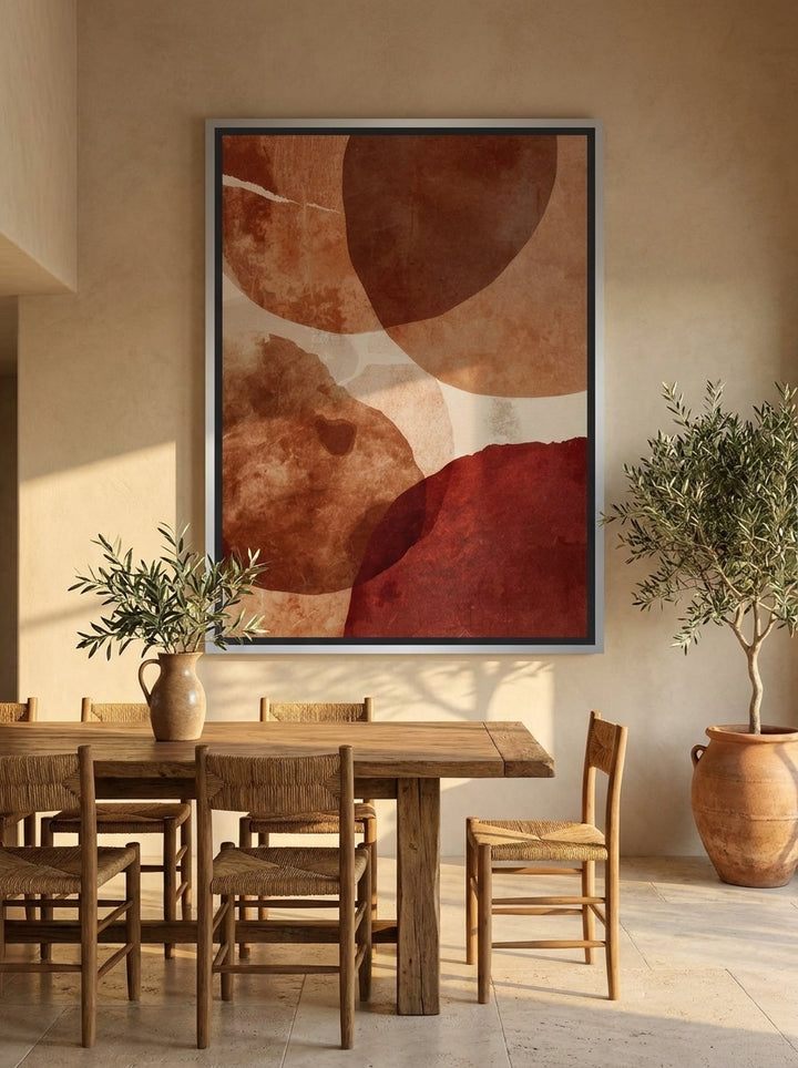 Oversized statement canvas wall art with a silver leaf surround styled on the wall in a Mediterranean dining room