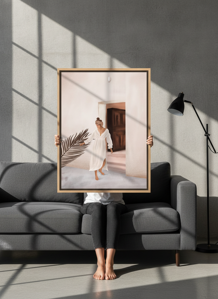 Person holding canvas wall art with a natural timber surround in an industrial loft living room