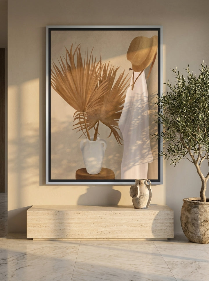Oversized statement canvas wall art with a silver leaf surround styled on the wall in a luxe living room