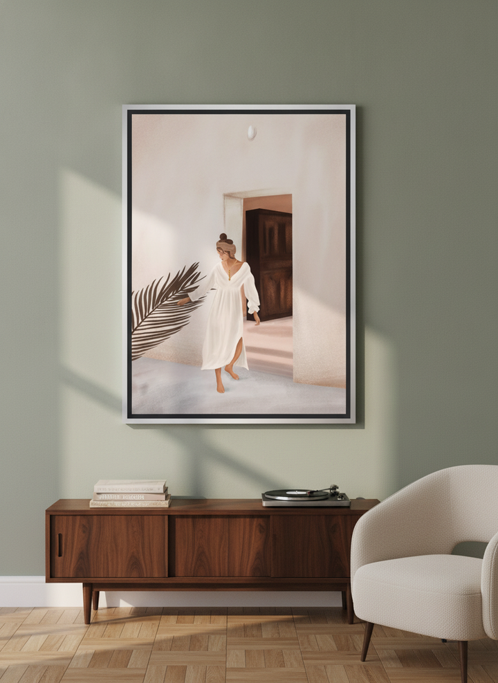 Oversized statement canvas wall art with a silver leaf surround styled on the wall in a mid-century living room