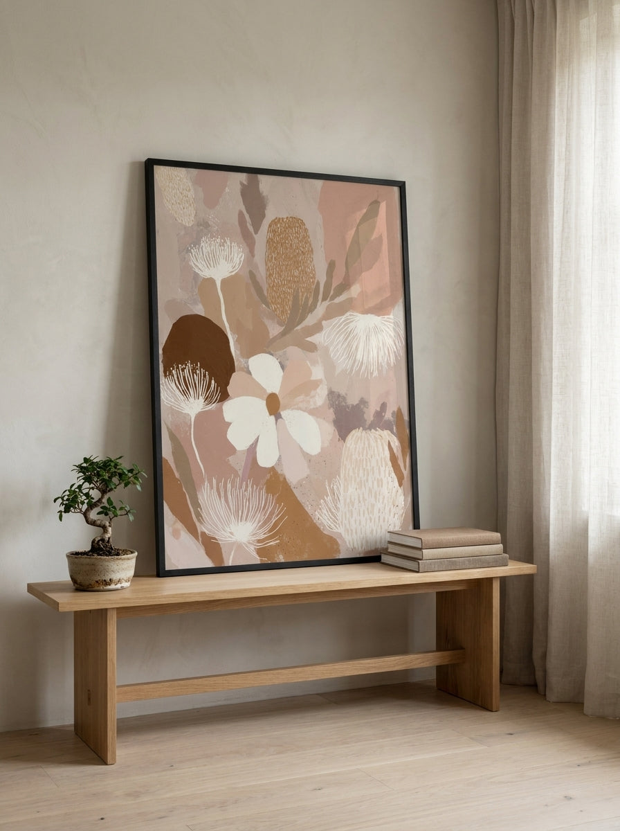 Modern wall art print standing on a bench in a warm Japandi bedroom