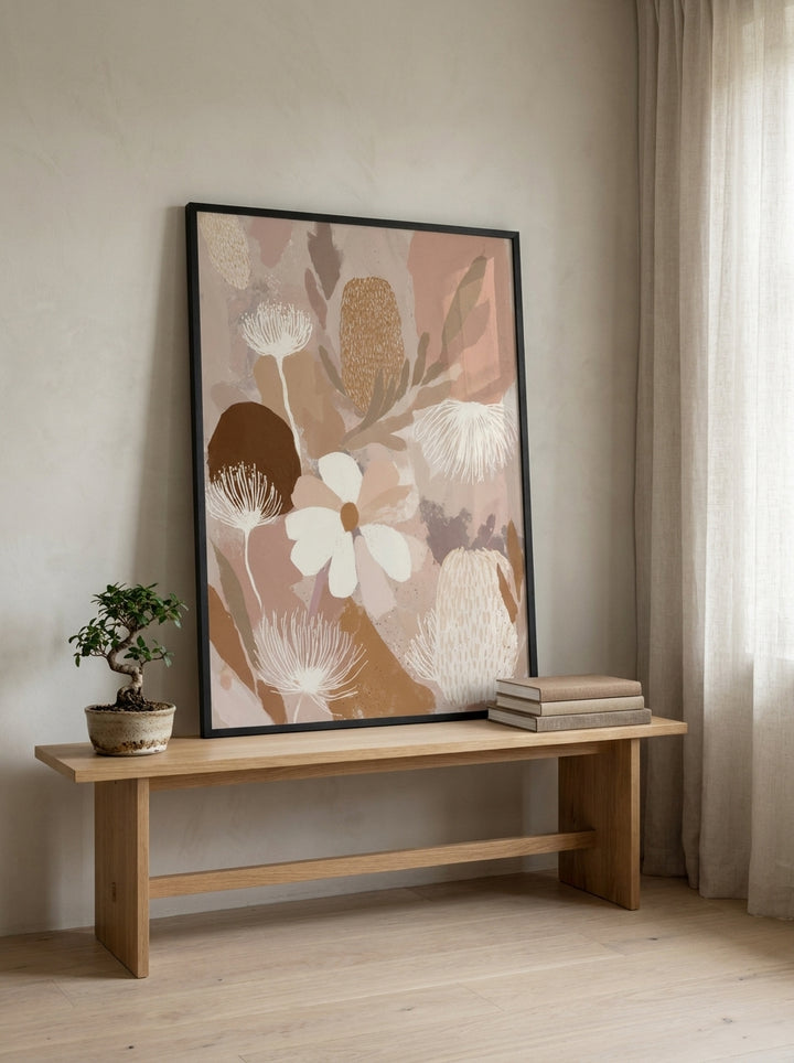 Modern wall art print standing on a bench in a warm Japandi bedroom