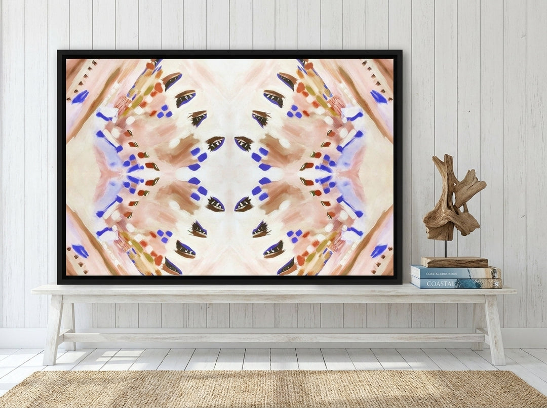 Canvas wall art with a black surround standing on a console in a coastal home office