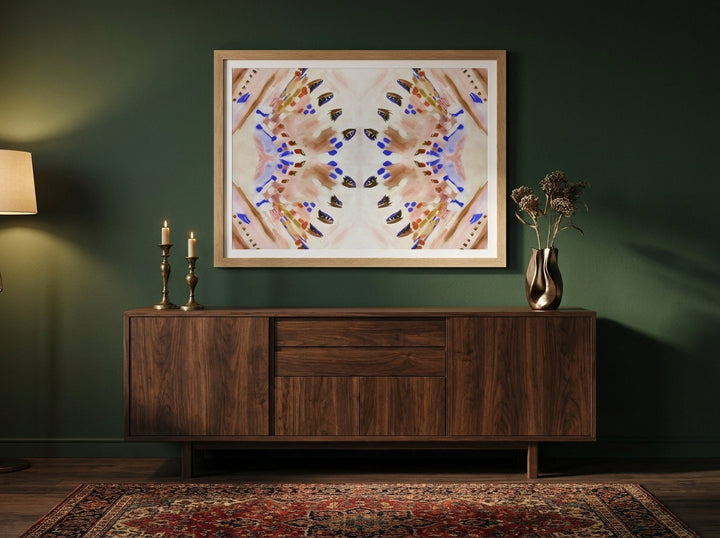 Modern wall art print styled on the wall in a moody living room