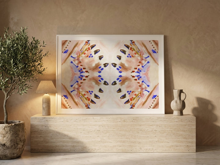 Modern wall art print standing on a console in a luxe bedroom