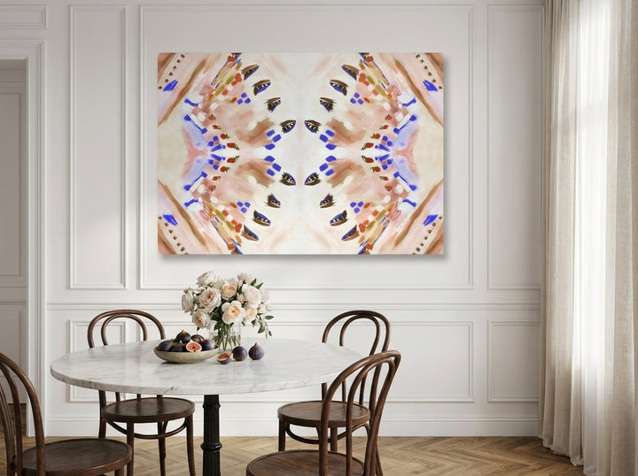 Stretched canvas wall art styled on the wall in a Parisian dining room