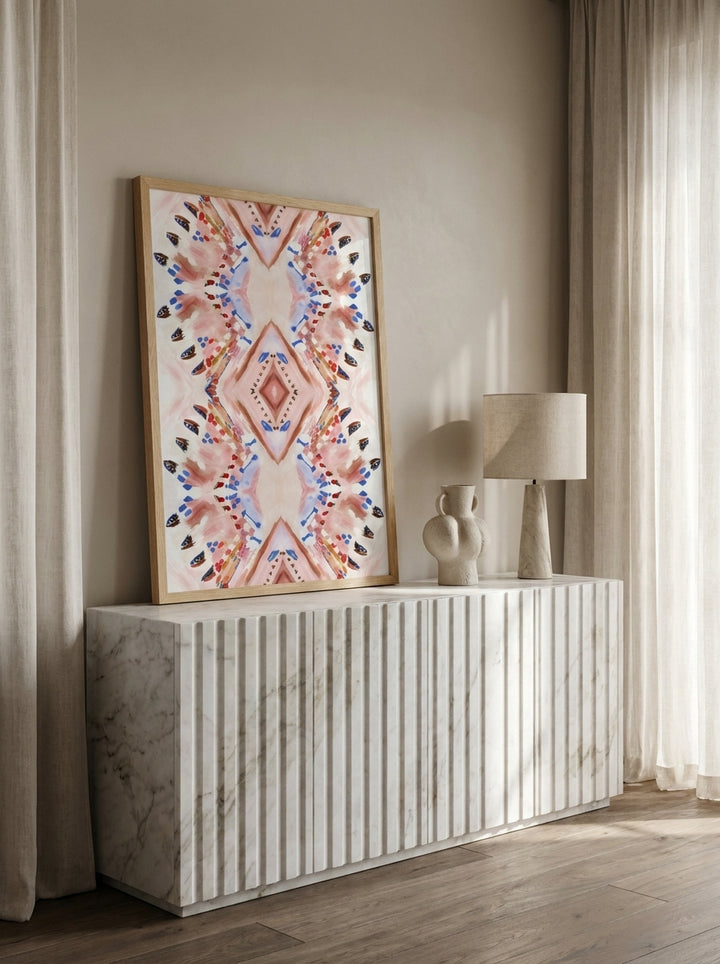 Modern wall art print standing on a sideboard in a luxe dining room