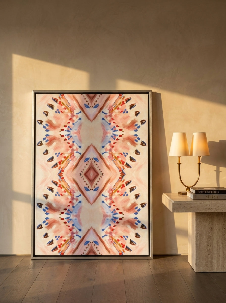 Canvas wall art with a silver leaf surround leaning against the wall in a luxe dining room