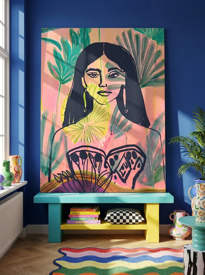 Stretched canvas wall art standing on a side table in a colourful eclectic dining room