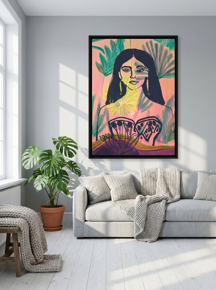 Oversized statement canvas wall art with a black surround styled on the wall in a bright Scandinavian living room