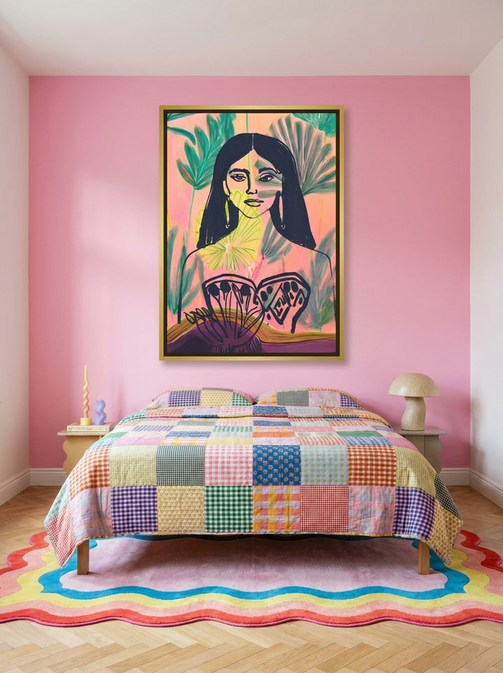 Oversized statement canvas wall art with a gold leaf surround styled on the wall in a colourful eclectic bedroom