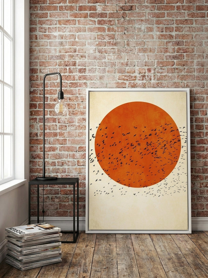 Canvas wall art with a white surround leaning against the wall in an industrial loft bedroom