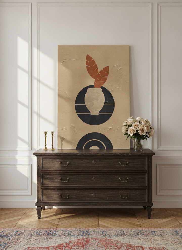Stretched canvas wall art standing on a sideboard in a Parisian home office