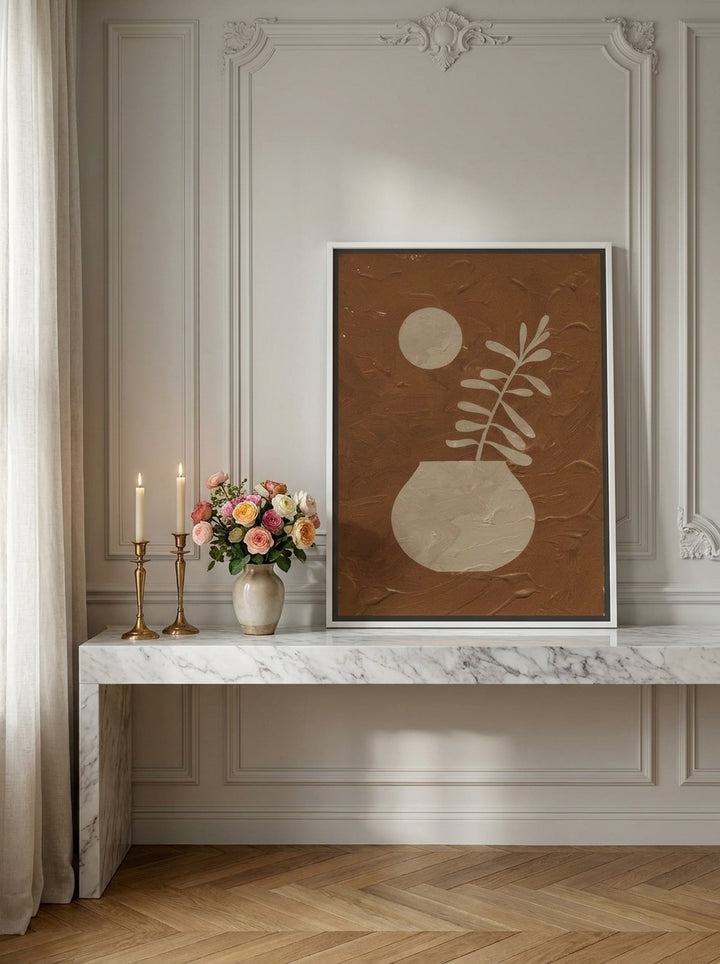 Canvas wall art with a white surround standing on a console in a Parisian bedroom