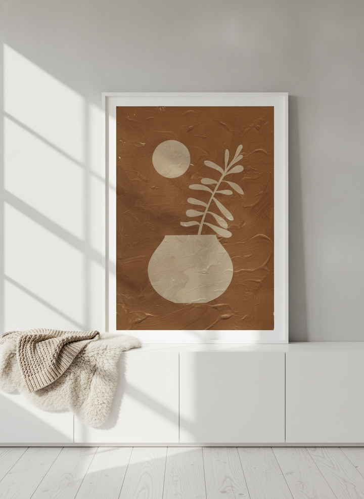 Modern wall art print standing on a sideboard in a bright Scandinavian home office