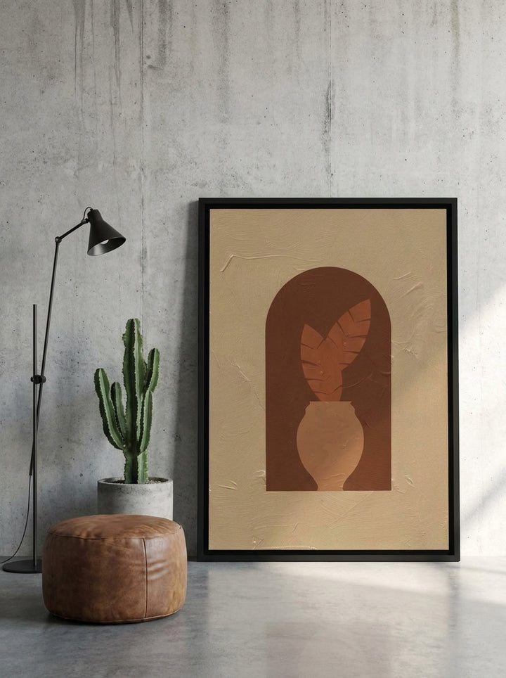 Canvas wall art with a black surround leaning against the wall in an industrial loft home office